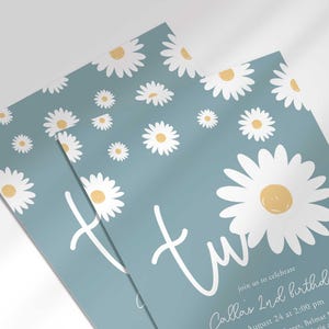 Close-up angled shot of the 'TWO' daisy-themed invitation for Callie's 2nd birthday, showing the print quality and daisy pattern detail.
