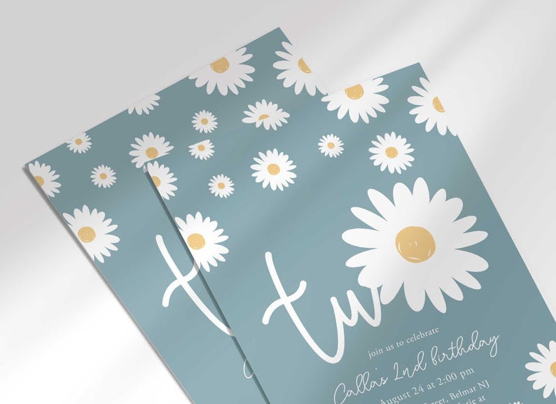 Close-up angled shot of the 'TWO' daisy-themed invitation for Callie's 2nd birthday, showing the print quality and daisy pattern detail.