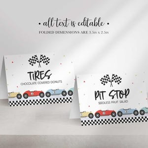 Two folded race car themed table labels displaying sample food titles TIRES CHOCOLATED COVERED DONUTS and PIT STOP SEEDLESS FRUIT SALAD.