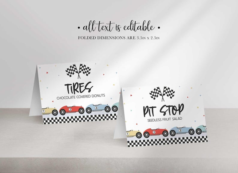 Two folded race car themed table labels displaying sample food titles TIRES CHOCOLATED COVERED DONUTS and PIT STOP SEEDLESS FRUIT SALAD.
