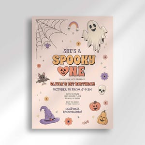 A full view of Olivia's Halloween-themed 'She's a Spooky One' first birthday invitation on a tan kraft-paper background with illustrated ghosts, bats, spiders, a witch hat, and pumpkins.