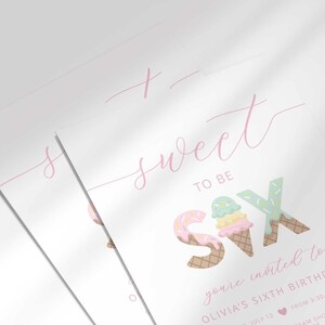 Close-up angled shot of two overlapping printed invitations, highlighting the script "sweet to be SIX" text and ice cream cone number-six graphic detail.