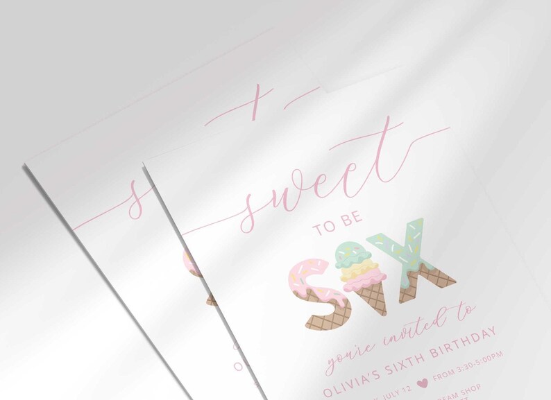 Close-up angled shot of two overlapping printed invitations, highlighting the script "sweet to be SIX" text and ice cream cone number-six graphic detail.