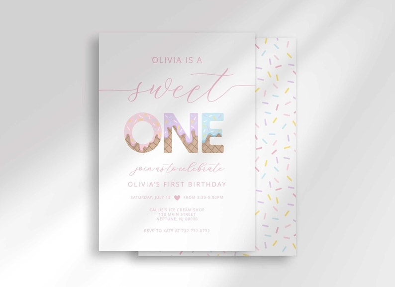Sweet One first birthday invitation card layered over a colorful confetti sprinkle patterned envelope liner, with "Olivia is a Sweet ONE, join us to celebrate Olivia's first birthday" text, ONE in a pink and tan textured font, and party details including date, time, and location.