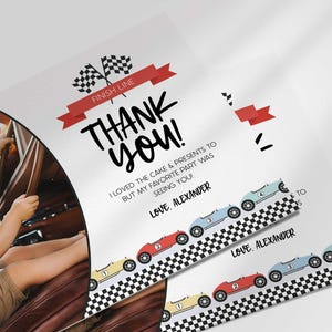 Angled close-up of Alexander's race car-themed thank you photo card with the boy's photo mockup, showing the checkered flags and colorful race cars with the thank you message.