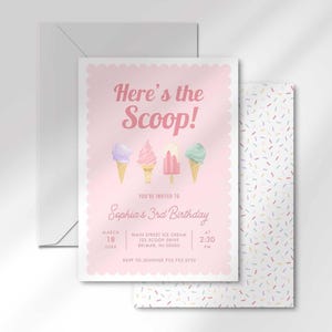 Invitation card angled in front of the matching colorful sprinkle-pattern back and a white envelope.