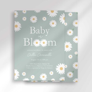 The 'Baby in Bloom' invitation for Calla Caravelli with a second card showing the daisy pattern back design peeking out behind it.