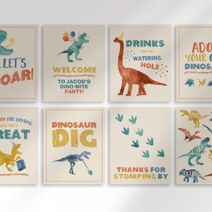 Grid overview of an 8-piece dinosaur-themed party sign set for Jacob's birthday: Let's Roar! silhouette sign, Welcome to Jacob's Dino-mite Party! sign, Drinks From the Watering Hole brontosaurus sign, Adopt Your Own Dinosaur sign, Thank You For Coming Please Take a Treat sign, Dinosaur Dig skeleton sign, Thanks for Stomping By footprints sign, and a dinosaur names chart.