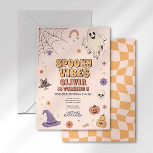 The 'Spooky Vibes' Halloween birthday invitation for Olivia layered in front of its matching envelope and a second card showing the orange checkered back design.