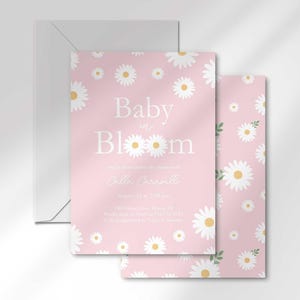 The 'Baby in Bloom' invitation for Calla Caravelli layered in front of its matching envelope and a second card showing the daisy pattern back design.