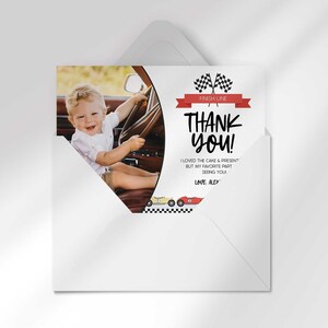 Alexander's race car-themed thank you photo card tucked inside its matching envelope, showing the boy's photo mockup and party thank you message.