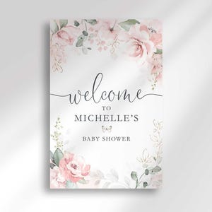 Flat close-up print mockup of the full "Welcome to Michelle's Baby Shower" sign design, showing the blush pink floral corner details and a small butterfly accent clearly.