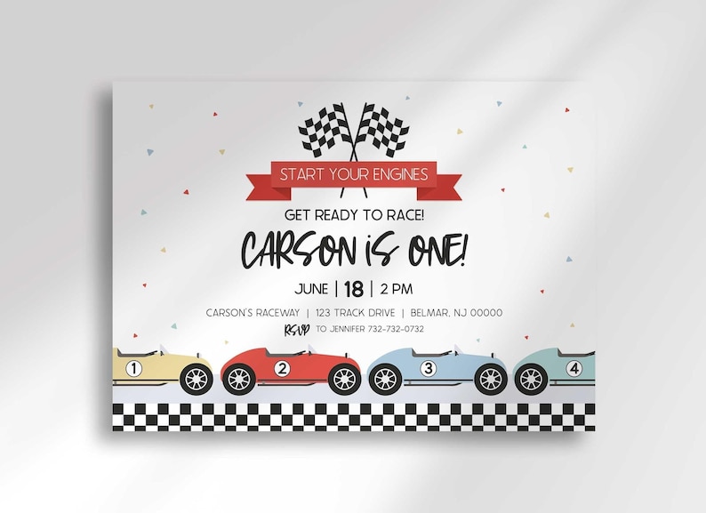 "Carson is ONE!" race car birthday invitation with checkered flags, a red "Start Your Engines" banner, and a row of colorful cartoon race cars.
