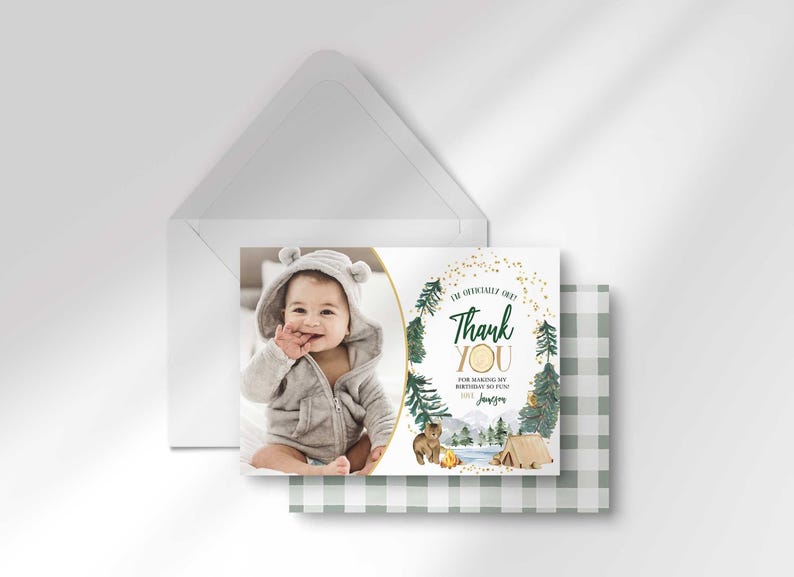 Jameson's camping-themed thank you photo card layered in front of its matching envelope and a second card showing the sage green plaid back design.