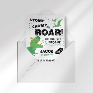 Jacob's dinosaur-themed birthday invitation peeking out of an open envelope against a white background.
