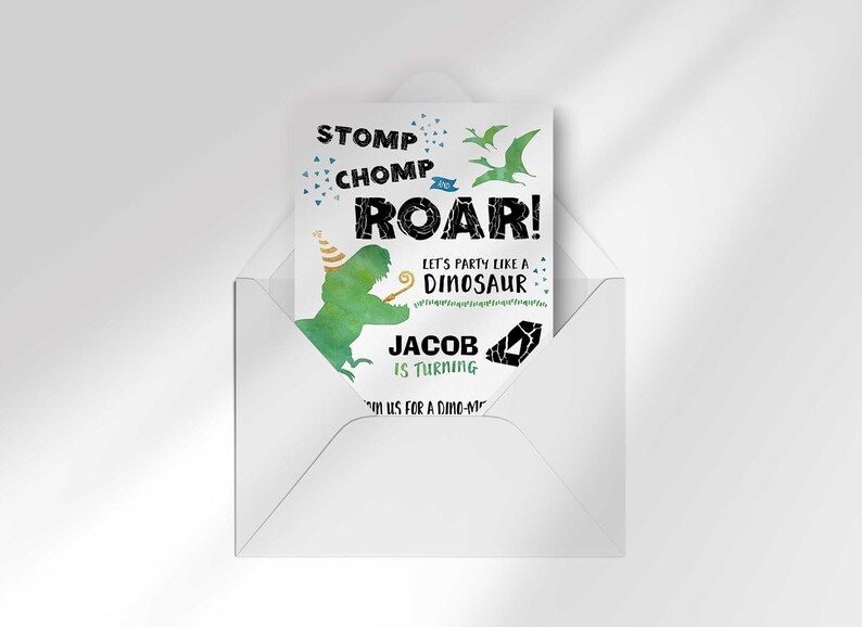 Jacob's dinosaur-themed birthday invitation peeking out of an open envelope against a white background.