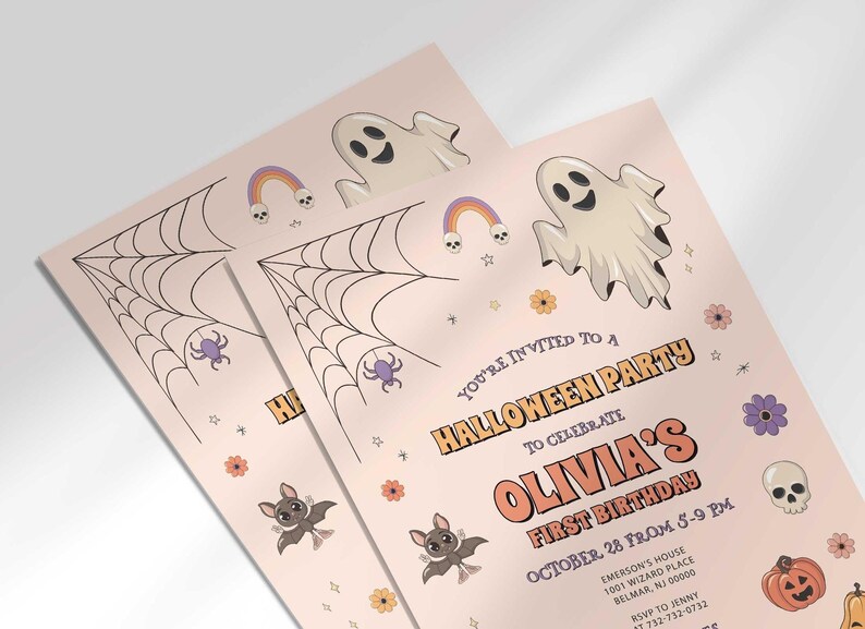 Angled close-up of Olivia's Halloween-themed first birthday invitation, showing the ghost, spiderweb, and bat illustrations with party details.
