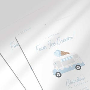 Close-up angled shot of two overlapping printed invitations, highlighting the watercolor ice cream truck and cone illustration and the script "I Scream, Four Ice Cream!" text detail.
