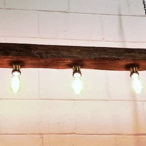 suspended wood beam light, beam lighting, wood beam lighting, rustic beam lighting, hanging wood beam light, hanging oak beam lights, suspended wood beam bulbs, rustic wood beam lights, vintage wood beam light, industrial beam light, industrial light