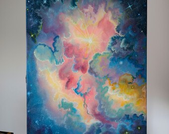May include: An original painting of a nebula, showcasing a vibrant display of colors. The artwork features a central burst of light surrounded by swirling clouds of pink, blue, and yellow hues, with scattered stars in the background. Signed by the artist, G. Delmar, 24.