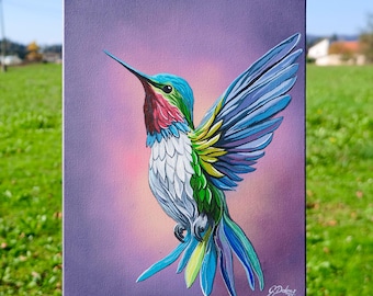 May include: A vibrant painting of a hummingbird with outstretched wings. The bird features a blue head, red throat, and a white chest, with wings in shades of blue and green. The background is a gradient of purple and pink.