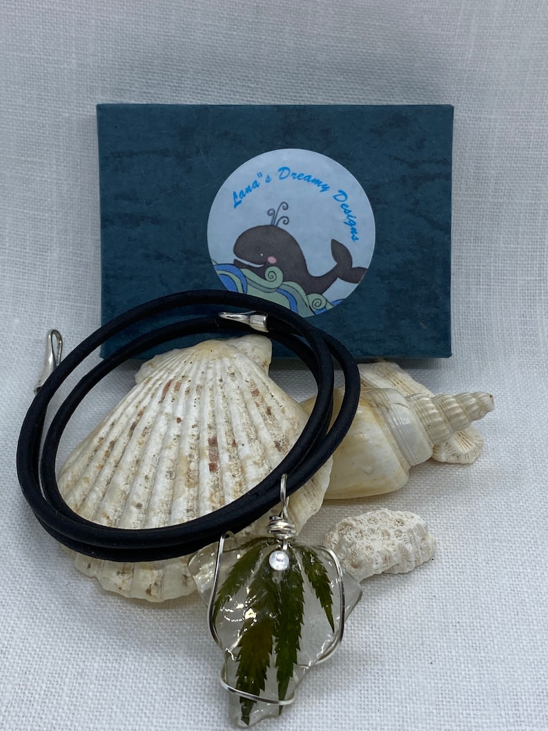 Handmade cannabis necklaces preserved on sea glass and coated in resin