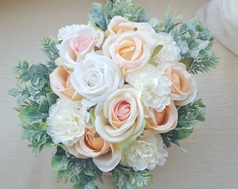 Peachy and white artificial flowers arrangement in light pink hat box. Peach roses, cream roses, greenery, wedding flowers, birthday gift