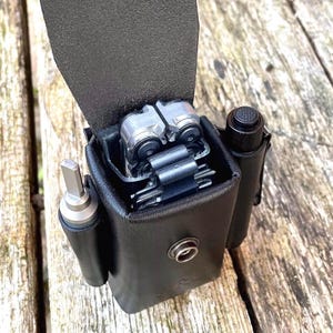 Leatherman Arc sheath with pouch for bit kit and extras. Fully customisable, from full grain leather and metal rivets