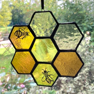Stained Glass honey bee sun catcher on honeycomb