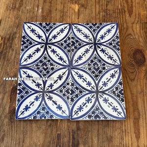 4”×4” Hand-painted ceramic tiles featuring a traditional Moroccan blue floral pattern