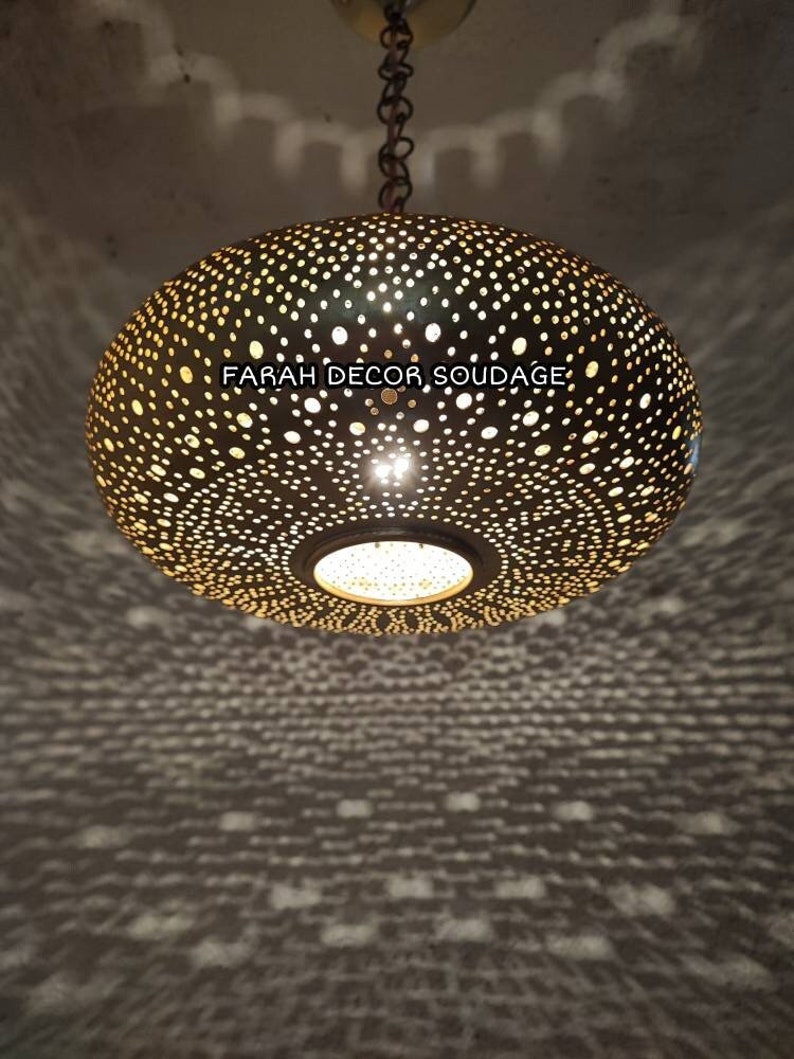 This piece of art is 100% handmade by sophisticated  Moroccan artisans using higher quality brass and following the old-fashion method of brass-engraving at a small workshop in old-medina Fez.Round Oriental Moroccan Brass Lantern – Ceiling Pendant Light - Moorish Lighting .