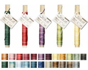 May include: Six spools of Soie et thread for hand stitching. The spools are made of wood and have a label with the brand name. The thread colors are green, red, purple, green, and yellow.
