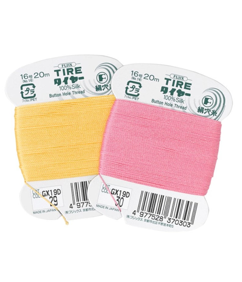 May include: Two spools of 100% silk buttonhole thread, one yellow and one pink. Each spool is labeled "FUJIX TIRE WIRE 100% Silk Button Hole Thread" and has a barcode.