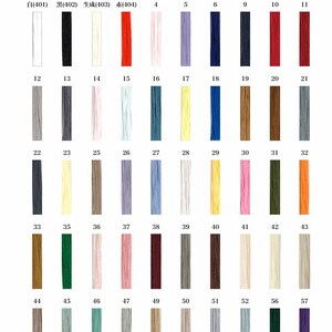 May include: Color variation chart showing 57 different thread colors. The chart is divided into rows and columns, with each color represented by a small square. The colors range from white to black, with shades of red, blue, green, yellow, and brown.