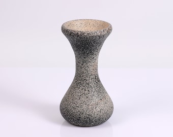 A stoneware look on a beautiful wood vase.
