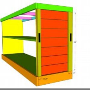 May include: A wooden shelf unit with a sliding door. The shelf unit is painted in various colors, including yellow, green, orange, and pink. The shelf unit has two shelves and a bottom base. The sliding door is made of wood slats and has two black handles.