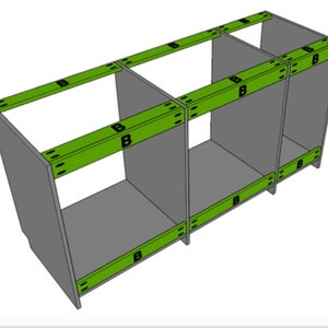 May include: A three-section cabinet with green support beams. The beams are labelled with the letter "B" and have a series of small holes along the top and bottom edges.