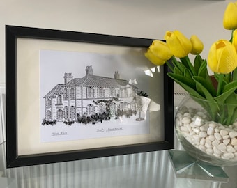 May include: A black framed print of a black and white ink drawing of a house with the text "Duchy Farmhouse" and "Tina Rich" below the drawing.