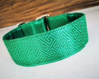 May include: A green dog collar with a geometric pattern. The collar is made of a soft, durable material and has a silver buckle.