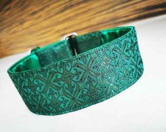 May include: A green dog collar with a patterned design. The collar is made of a soft, durable material and has a secure buckle closure.