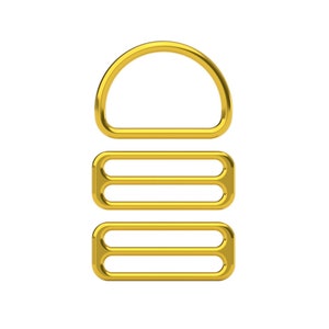 May include: Gold-toned metal slider buckle with three loops. The buckle is designed for attaching straps or belts.