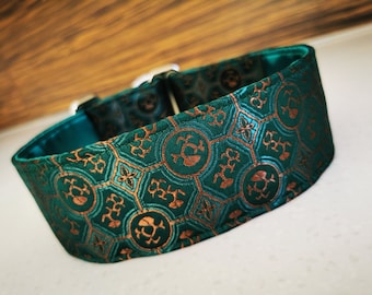 May include: A green and copper dog collar with a geometric pattern. The collar is made of a soft, durable fabric and has a secure buckle closure.