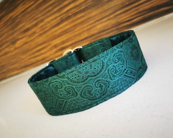 May include: A green patterned dog collar with a silver buckle.