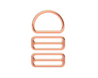 May include: A set of three copper-colored metal slider buckles. The top buckle is a D-ring shape, and the two bottom buckles are rectangular with two parallel slots.