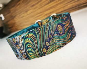 May include: A green, blue, and gold patterned dog collar with a teal lining. The collar is made of a soft, durable fabric.