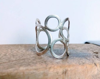 Wide silver ring with circles, adjustable.