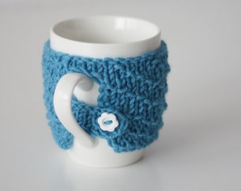 Cute cup with warm sweater