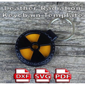 May include: A black and yellow radiation symbol keychain template made of leather. The keychain has a silver ring and a black leather loop. The text "Leather Radiation Keychain Template" is at the top of the image.