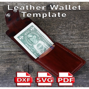 Puede incluir: Plantilla de cartera de cuero marrón con un billete de dólar en el interior. La cartera está abierta, mostrando el billete. El texto "Leather Wallet Template" está en la parte superior. Debajo hay iconos etiquetados DXF, SVG y PDF.