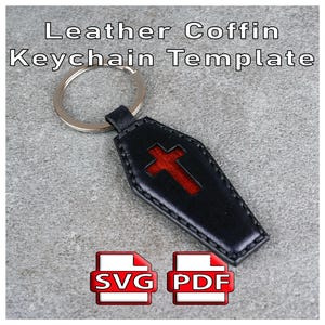 May include: A black leather coffin-shaped keychain with a red cross cutout, attached to a silver metal ring. The text "Leather Coffin Keychain Template" is visible at the top, with "SVG" and "PDF" icons displayed at the bottom of the image.